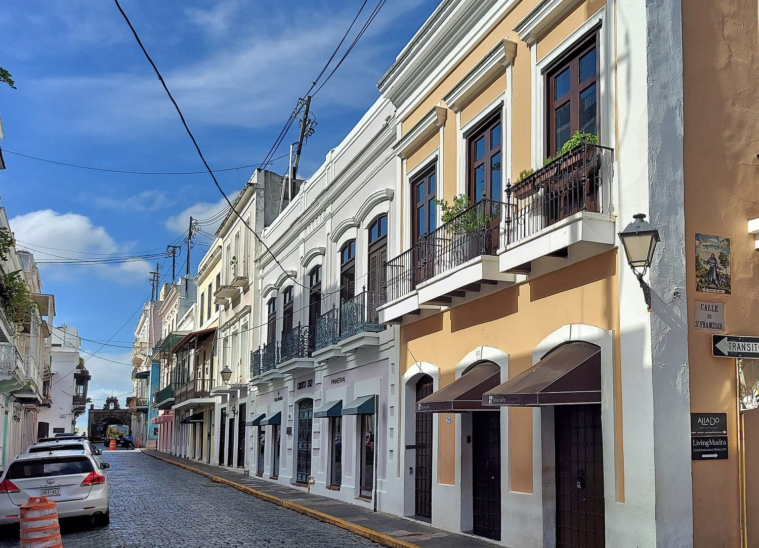 A colonial street in Old San Juan with balconies and blue cobblestones