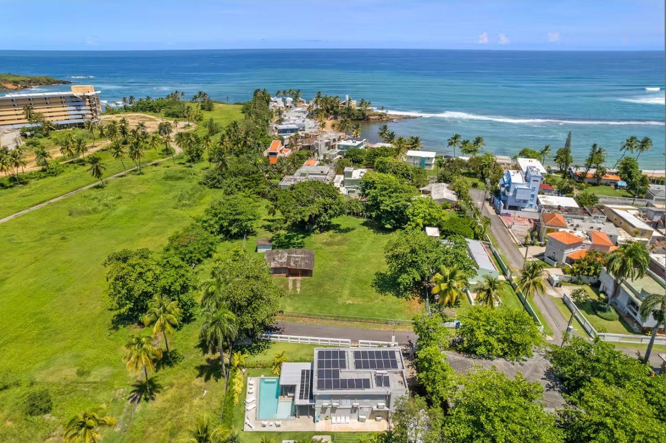 Aerial of Capri Beach House, pool, and the ocean