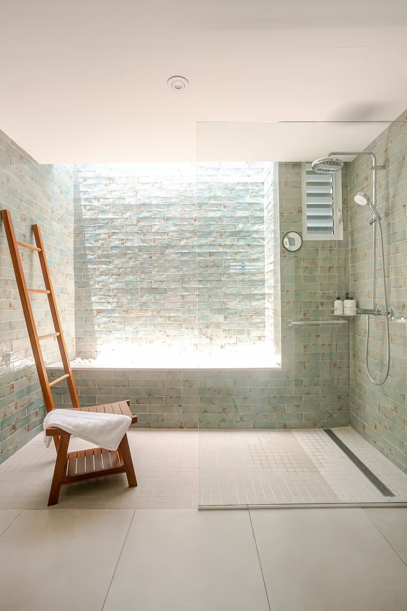 Sea-glass tiled walk-in shower and bath