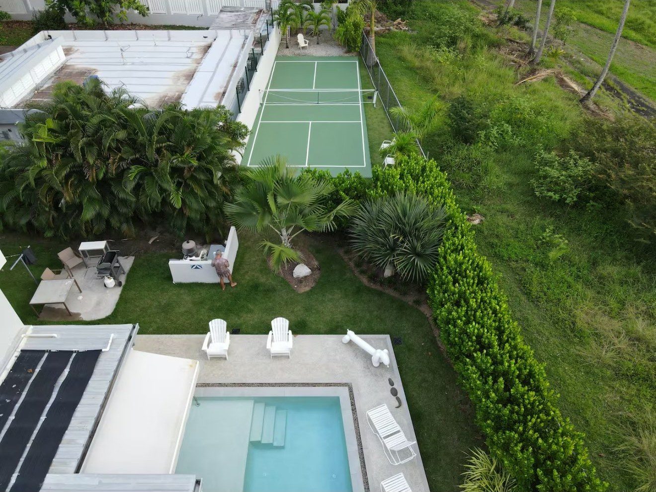 Aerial showing the pickleball court, pool, and grill area